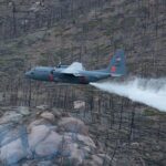 Reservist pilots and loadmasters assigned to the 302nd Airlift Wing drop potable water over Hayman Fire burn scar during their annual aerial wildland firefighting training and certification with the U.S. Department of Agriculture Forest Service, May 13, 2021, Pike-San Isabel National Forest, Colorado. The 302 AW and 153rd Airlift Wing C-130 Hercules aircraft, equipped with the U.S. Forest Service’s Modular Airborne Fire System, began their weeklong training and certification out of Jeffco Airtanker Base, Colorado, where they conducted training drops with potable water at nearby Arapaho/Roosevelt and Pike-San Isabel National Forests and Bureau of Land Management lands. (U.S. Air Force photo by Tech. Sgt. Justin Norton)