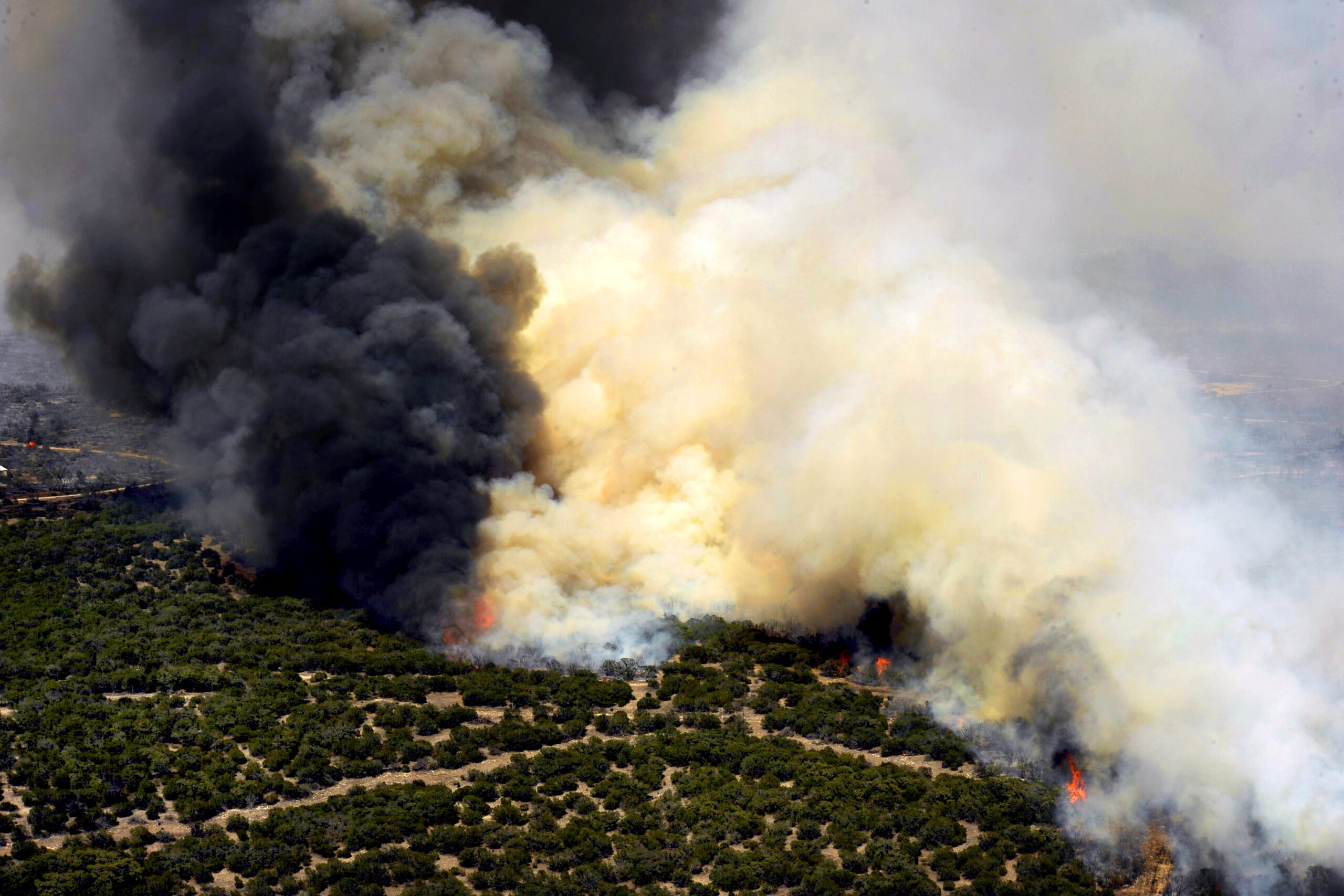 The Oasis wildfire burns in West Texas as fire fighting crews try to contain it, April 26. Wildfires have spread across various parts of Texas and have burned more than 1,000 square miles of land.